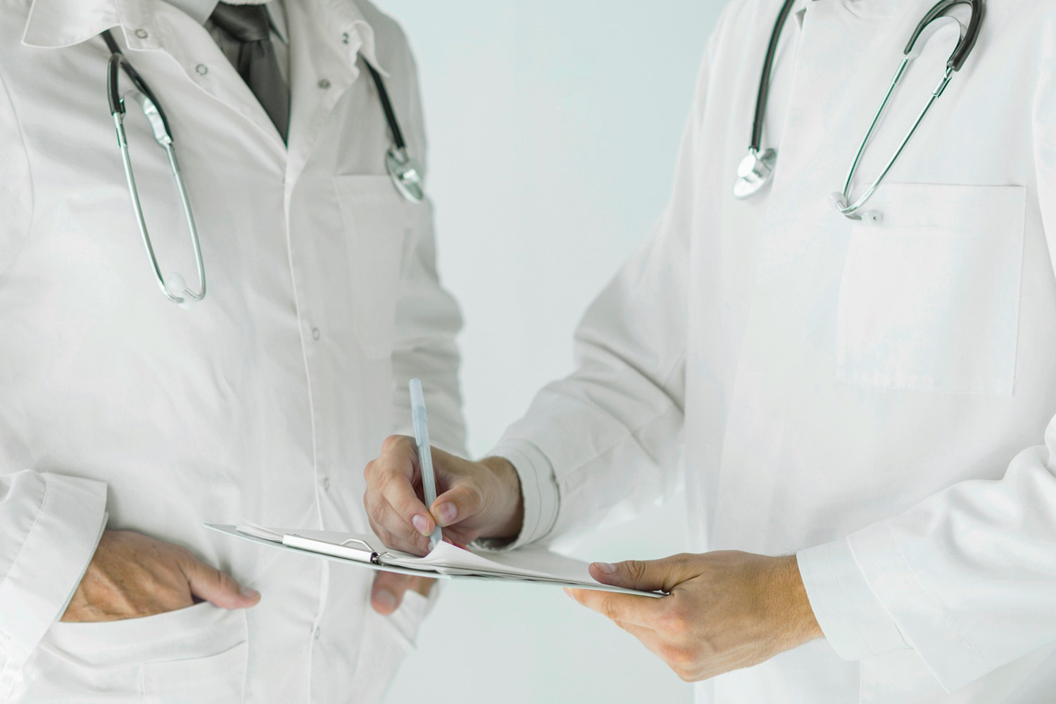 Physicians reviewing a case